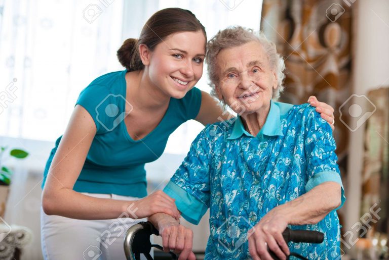 14298409-Senior-woman-with-her-caregiver-at-home-Stock-Photo-care-elderly-senior